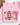 A folded light pink sweatshirt on a white surface with a brown hat and dried flowers as props. The front has a large decorative word graphic reading 'COZY' in mixed winter-themed patterns including plaid, polka dots, floral snowflakes, and snowmen.