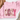 A folded light pink sweatshirt on a white surface with a brown hat and dried flowers as props. The front has a large decorative word graphic reading 'COZY' in mixed winter-themed patterns including plaid, polka dots, floral snowflakes, and snowmen.