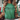 green t-shirt with Christmas-themed text and lights