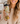 Woman holding a colorful water bottle with 'Amazing Grace' text and floral designs.