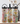 Three colorful water bottles with floral and abstract designs on a wooden surface.
