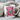 Mug with a pink armchair and book design, text 'My weekend is all booked', surrounded by cozy blankets.
