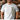 Man wearing a white t-shirt with 'CHISEN' printed in camouflage text, standing in a blurred indoor setting.
