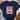 Navy blue t-shirt with 'Ice Coffee is my Sunshine' design on a textured surface.