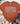 A rust-orange graphic t-shirt with 'COFFEE WEATHER' printed in leopard-print and tan lettering, styled in a flat-lay with jeans, boots, a throw blanket, and eucalyptus on a white wood background.