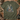 An olive green short-sleeve t-shirt with a detailed graphic of three deer in a pine forest, laid flat on a rustic wood background surrounded by hunting-themed props like a camouflage cap, binoculars, and a boot.