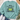 A mint green crewneck sweatshirt laid flat on a white wood background, styled with blue jeans, white sneakers, a straw hat, and eucalyptus leaves. The sweatshirt features a graphic of a green toad with a yellow belly and the text 'BORN TO DILLY DAILY & KNOWN TO LOLLYGAG'.