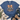 A blue short-sleeve graphic T-shirt laid flat on a light wood surface, styled with a scarf, jeans, and boots. The shirt features a raccoon illustration with a leopard-print bow, autumn leaves, pumpkins, and the text 'feral girl autumn'.