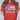 Red t-shirt with a decorative design featuring a bow, flowers, and polka dots on a plain background.