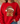 A person wearing a bright red crewneck sweatshirt with a large gingerbread cookie graphic wearing a leopard-print Santa hat and glasses on the front, paired with blue jeans.