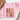 A folded light pink sweatshirt with a graphic reading 'GOBBLE GOBBLE' in multicolored patterned letters, styled on a white surface with a tan hat and dried flowers nearby.