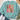 A mint green crewneck sweatshirt featuring a colorful 'COBBLE GOBBLE' graphic with various patterned lettering, styled in a flat lay with jeans, white sneakers, a straw hat, and eucalyptus on a white wood background.