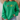 A person wearing a bright green crewneck sweatshirt with a graphic of four cartoon sports characters walking across the chest, paired with light blue jeans in a home setting.