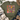 An olive green short-sleeve t-shirt with a colorful floral graphic and the text 'Happiness comes FROM WITHIN' printed on the front. The shirt is styled in a flat-lay arrangement with a straw hat, blue jeans, a beige knit blanket, and a pair of beige lace-up boots on a white wood background.