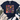 A navy blue graphic t-shirt with a colorful floral design and the text 'Happiness is found FROM WITHIN' in the center. The t-shirt is styled in a flat-lay arrangement with distressed blue jeans, white sneakers, a fringed throw blanket, and green leaves on a white wood background.