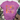 A heather purple short-sleeve t-shirt with a colorful floral graphic and the text 'Happiness and joyous living' printed on the front, styled in a flat-lay with jeans, a knit blanket, and lace-up shoes on a white wood background.