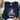 A navy blue sweatshirt with a white graphic of a frog riding a bicycle and the text 'BE HUMBLE BE KIND leave your worries BEHIND', laid flat on a white wood background with a hat, jeans, and shoes partially visible around it.