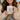 Woman holding a mug with 'Powered by Jesus & Coffee' text and design.