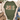 An olive green graphic t-shirt styled in a flat lay with a beige knit cardigan, blue jeans, brown suede boots, and pinecones. The t-shirt features a distressed graphic reading 'JESUS IS the reason' with a rustic holiday theme.