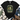 A black graphic t-shirt featuring a green frog riding a bicycle with flowers, surrounded by the text 'CHOOSE KINDNESS BE THE GOOD leave your worries BEHIND'. The t-shirt is styled in a flat-lay arrangement with blue jeans, brown lace-up boots, a beige and black striped throw blanket, and green leaves on a white wood background.