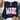 A navy blue long-sleeve t-shirt with a graphic reading 'MADE for more EPHESIANS 2:10' in pink and floral patterned lettering, styled in a flat lay with jeans, a hat, shoes, and greenery on a white wood background.