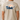Snd t-shirt with a graphic of a man and his dog  in a boat on the back, set against a plain background.