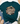 A dark teal graphic t-shirt styled in a flat lay with blue jeans, beige loafers, a straw hat, and greenery on a white wood background. The t-shirt features a graphic that reads 'MOUNTAIN MOVER' with 'MATTHEW 11:28-29' and a cross icon.