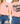 Pink t-shirt with 'Mustard Seed Faith' text on a person wearing blue jeans.