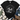 A black short-sleeve graphic T-shirt laid flat on a white wood background, styled with blue jeans, brown shoes, a cream throw blanket, and greenery. The shirt features a large black-and-white nativity scene print on the front showing Mary, Joseph, baby Jesus in a manger, and a donkey.