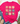 A bright pink short-sleeve t-shirt with a graphic of nine cute cartoon pigs in different patterns, styled in a flat lay with blue jeans, beige loafers, a straw hat, and eucalyptus on a white wood background.