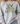 A person wearing a light heather gray crewneck sweatshirt with a detailed graphic of mallards and the text 'I will praise Him in every season' on the front, paired with blue jeans.