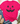 A bright pink short-sleeve T-shirt with a distressed black jack-o'-lantern face graphic, styled in a flat lay with blue jeans, beige loafers, a straw hat, and eucalyptus on a white wood background.