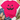A bright pink short-sleeve T-shirt with a distressed black jack-o'-lantern face graphic, styled in a flat lay with blue jeans, beige loafers, a straw hat, and eucalyptus on a white wood background.