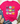 A bright pink short-sleeve t-shirt with a graphic of nine patterned pumpkins, styled in a flat lay with blue jeans, tan loafers, a straw hat, and eucalyptus on a white wood background.