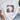 White t-shirt with patriotic graphic design on a white surface with shoes and jeans.