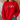 A person wearing a bright red crewneck sweatshirt with a graphic of four cartoon sports figures on the chest, paired with blue jeans in a softly lit indoor setting.