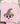 A light pink crewneck sweatshirt laid flat on a white wood background, featuring a cute scarecrow face graphic with a leopard-print witch hat, pink flower, and pink stitched smile. Styled flat-lay props include blue jeans, a mug, and small greenery.