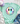 Mint green t-shirt with a colorful smiley face design on a light gray surface with accessories.