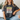 Person wearing a t-shirt with 'Sunshine on My Mind' text, sitting on a couch.