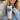 Person holding a tumbler with a dog-themed design and text.