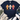 A navy blue graphic t-shirt laid flat on a white wood background, styled with a cream fringed throw, greenery, distressed blue jeans, and white sneakers. The t-shirt features three colorful glittery crosses (orange, light blue, and pink) with bows, and the text 'Grateful Thankful Blessed' and 'GOD IS FAITHFUL IN EVERY SEASON'.