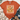 An orange short-sleeve t-shirt with a Thanksgiving turkey graphic, styled in a flat-lay arrangement with blue jeans, a knit blanket, and beige ankle boots on a white wood background.