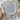 Gray t-shirt with 'USA' text design on a light surface with decorative items.
