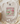 Beige t-shirt with 'Vintage is my favorite color' graphic on a soft surface.